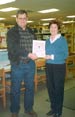 Camp donates book to Fairview library.